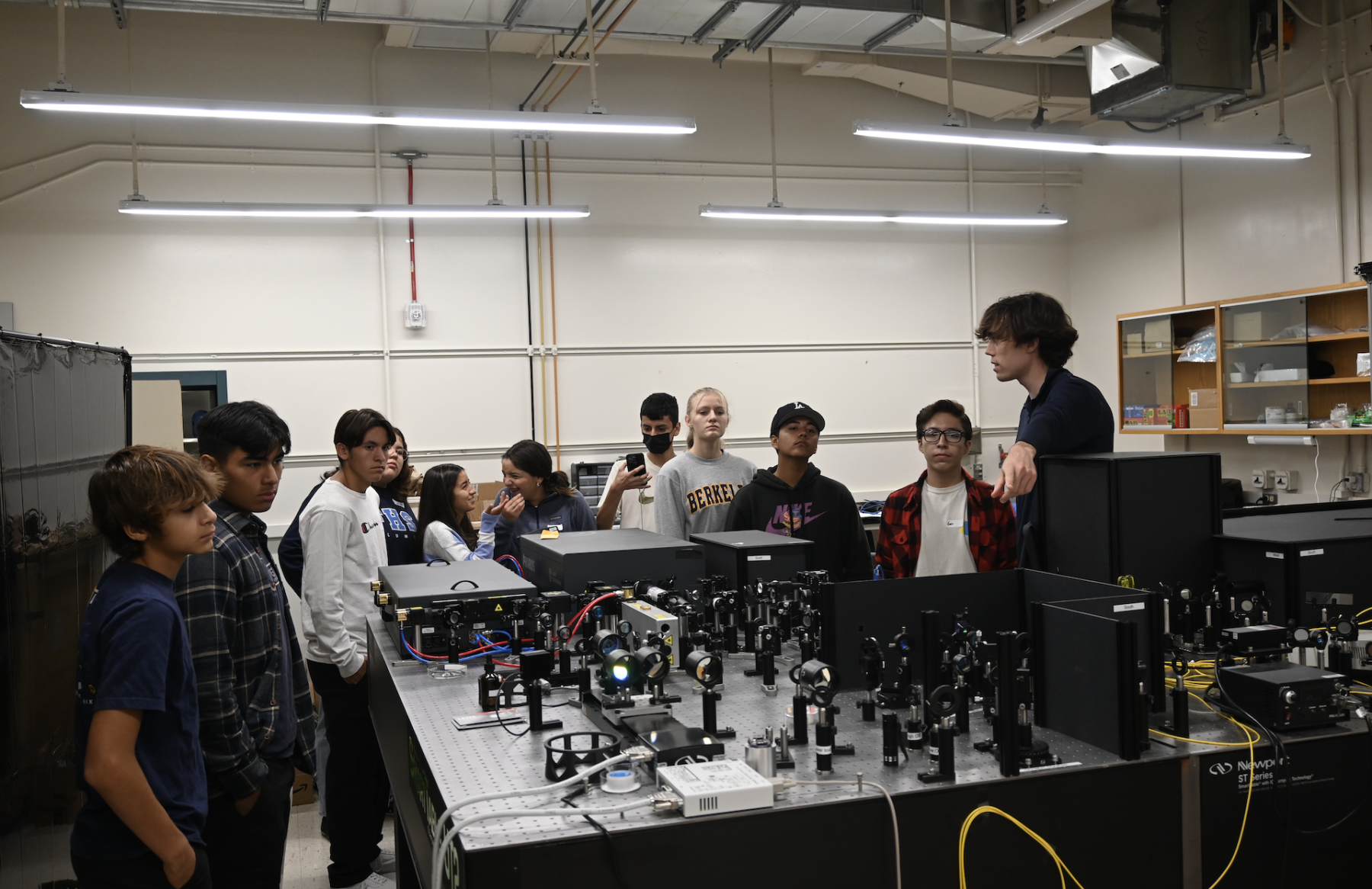 Simon Mitchell, student instructor, leads a tour of the Jin Lab of Optical Imaging and Ultrafast Spectroscopy