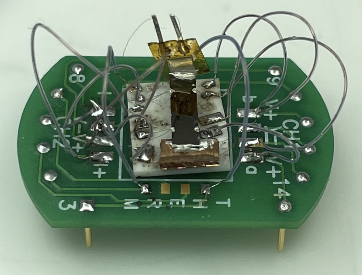 Image from UCSB Current Article: This device tests the properties of the cadmium arsenide thin film — the black strip in the center