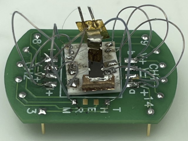 Image from UCSB Current Article: This device tests the properties of the cadmium arsenide thin film — the black strip in the center